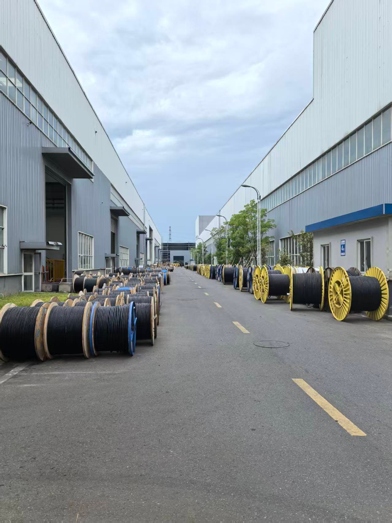 Cable reels along a CYYGH Electric factory lane